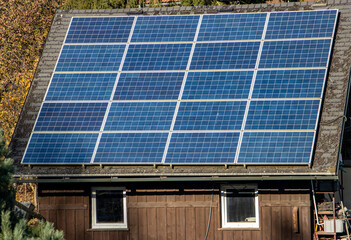 Solar panels mounted on the roof of a garden house