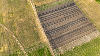 Aerial view of a land with sown fields in countryside. Landscape agriculture. Countryside. Top view...