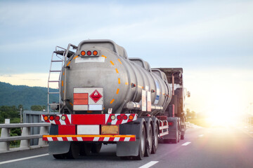 Naklejka na ściany i meble Trucks transporting dangerous chemical on the road