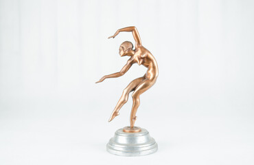 Antique bronze statue of a nude dancer