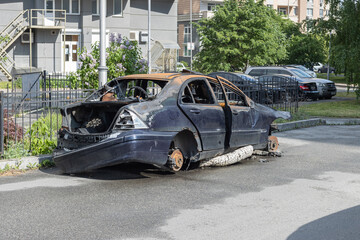 The car after the fire. Iron parts of a burnt car. Ukraine.