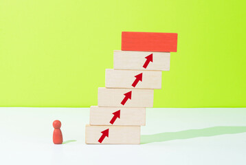 Figurine moving up the ladder
