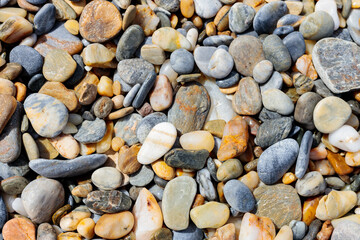 Sea stone pebble background. Abstract nature background with pebble stones. Full frame shot of multicolored pebbles. Close-up. Top view