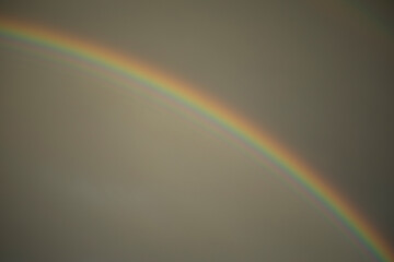 Fototapeta premium Rainbow in sky. Atmospheric phenomenon. Refraction of light.