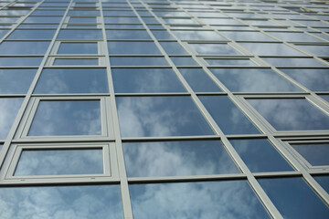 Mirror building. Reflection in windows. Modern architecture.