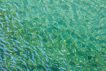 Texture of turquoise transparent water, water texture