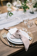 Boho wedding table set. vintage dining table with decorations, flowers and pampas grass  Boho style. Table set for an event, party, date or wedding.