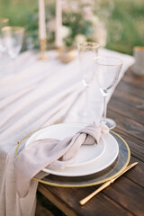 Boho wedding table set. vintage dining table with decorations, flowers and pampas grass  Boho style. Table set for an event, party, date or wedding.