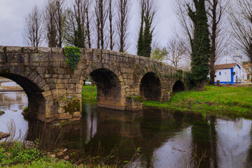 Fototapeta na wymiar Old roman stone bridge over Sever river in Portagem - Marvão, Portugal