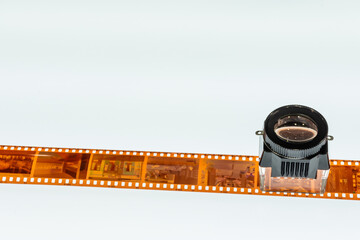 Section of film and film Negative Viewer on a projector table. With copy space for free text