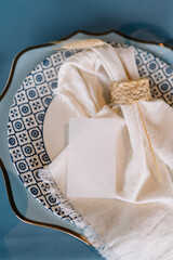 Fototapeta na wymiar Rustic. Vintage banquet table setting: plates, linen napkins