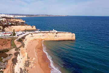Fototapeta premium Aerial from the Algarve coastline at Church Senhora de Nossa in Armacao de Pera Portugal
