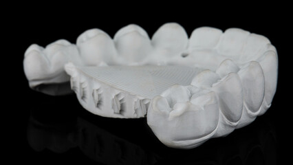 dental prosthesis of the upper jaw from milled zircon on a black background