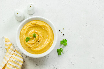 Mashed split pea with herbs and olive oil. Top view, copy space, flat lay.