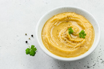 Vegetarian split pea soup puree with herbs and olive oil. Top view, copy space, flat lay.
