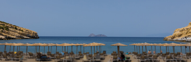 Umbrellas on the sea beach of the Greek resort