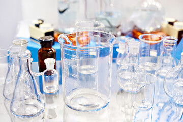 Laboratory glass bottles and flasks in store