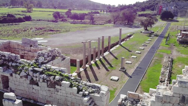 Drone View Of The Archaeological Site With Ancient Stone Walls, Road And Columns Ruins