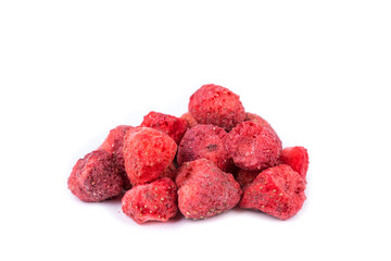 Freeze dried topless strawberries in a heap isolated over white