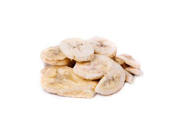 Freeze dried banana pieces in a heap isolated over white.