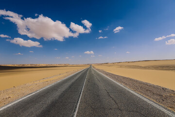 Naklejka premium Asphalt Road View of the White Desert Protected Area in the Farafra Oasis, Egypt