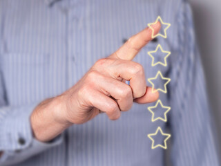 Man hand giving feedback. Star rating of service quality at virtual screen. Customer satisfaction...