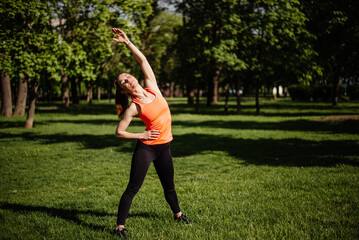 Morning woman workout in the park.