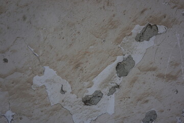 peeled off white part exposed wall, close up, background