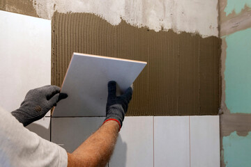 The process of laying tiles. Home improvement, home renovation concept