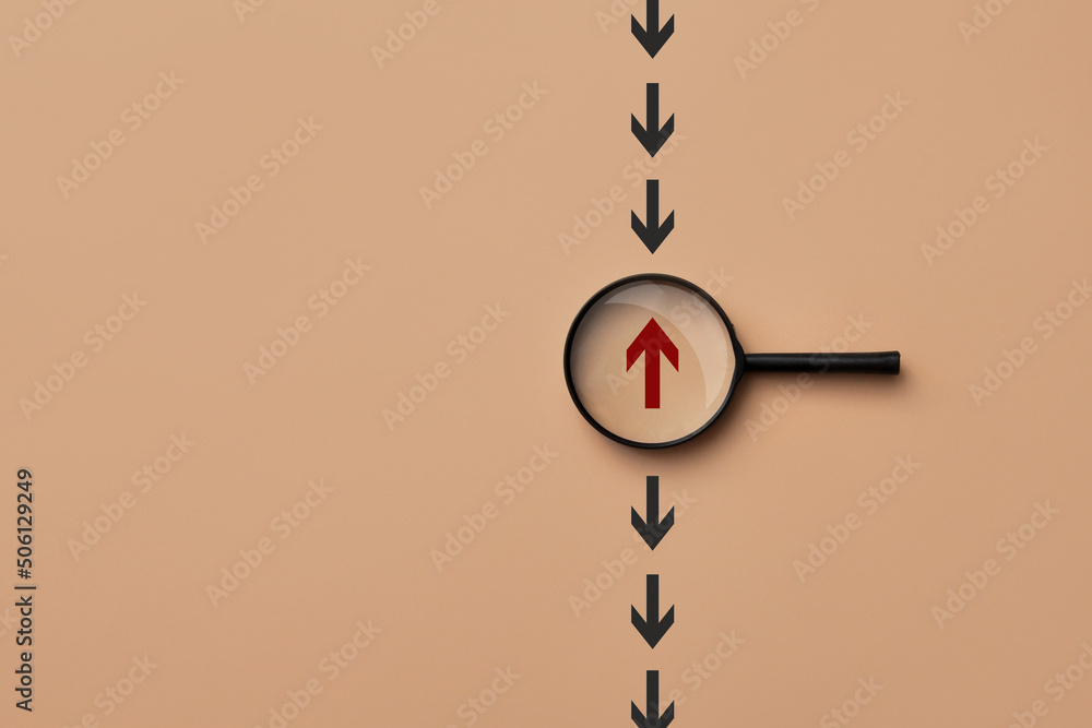 Poster many arrows point in one direction, and one moves in the other direction. a symbol of choosing a dif