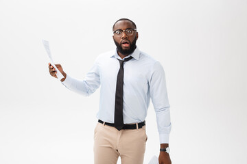 Happy African American man holding documaent paper over isolated white background with a surprise...