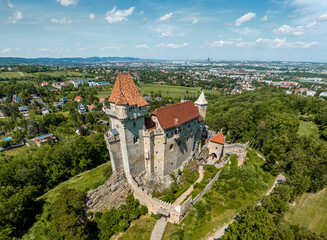 Austria - Liechtenstein Castle from the sky. The Liechtenstein Castle, situated on the southern edge of the Vienna.  Amazing view about a medieval castle - Powered by Adobe