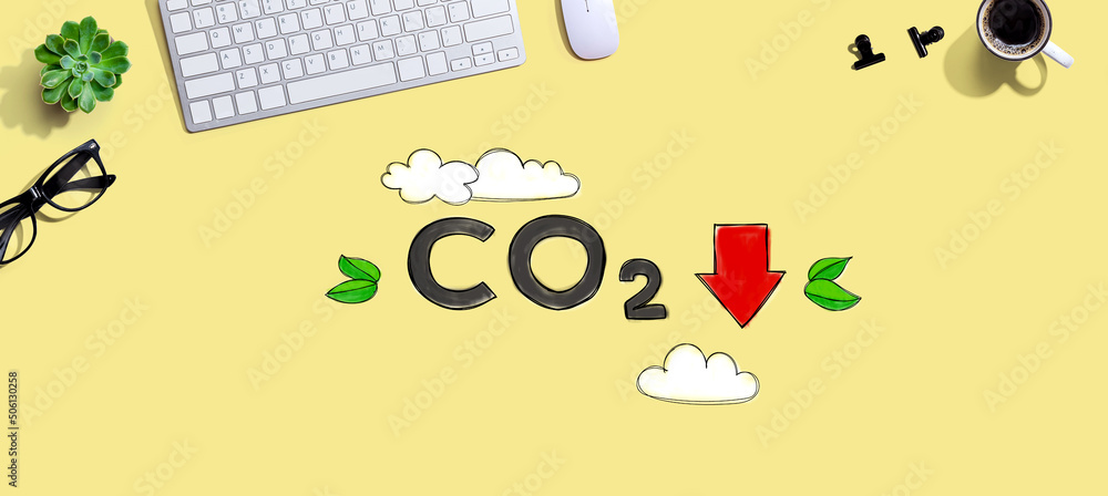 Aufkleber reduce co2 concept with a computer keyboard and a mouse