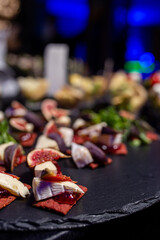 canapes with figs and soft cheese on the buffet