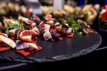 canapes with figs and soft cheese on the buffet