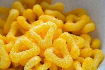 snacks and chips on a white plate close-up
