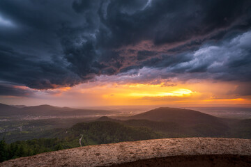 A storm cell moves over the Murgtal valley in the northern Black Forest, Germany, during sunset.