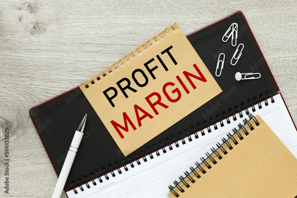 Poster profit margin text on a torn page from a notepad