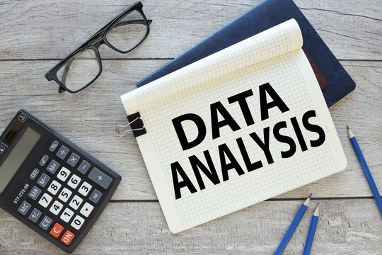 Data Analysis . text on a notepad page. two notebooks on the table