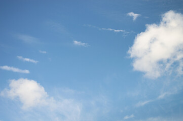 Blue sky with parallel stripes of chemical trails