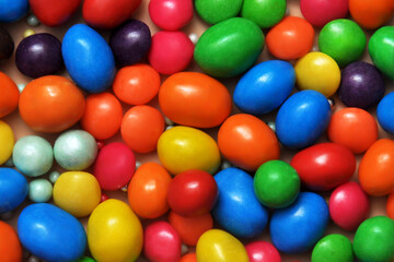 Fototapeta na wymiar Bright multicolored background of round candies