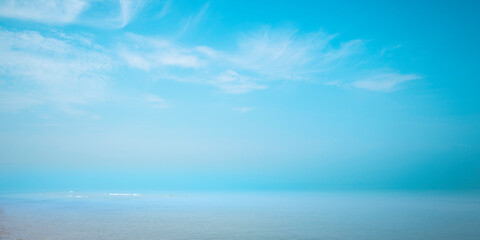 Obraz premium Blue seascape with dramatic clouds and fog. Tranquil summer ocean landscape in Cape Cod Bay in Massachusetts.