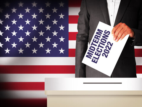 Midterm Elections 2022 in United States of America with Man holding Voting Paper on the box. Voting and elections concept background