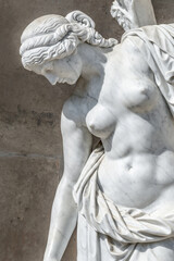 Old statue of a sensual renaissance era woman in Potsdam, Germany