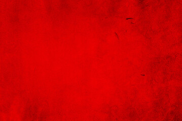 Red matte background of suede. Velvet texture of seamless leather. Red suede texture.