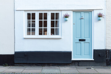 Home entrance with retro blue door. - 506138094