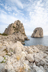 Fototapeta na wymiar Faraglioni rocks near the coast of Capri, Italy
