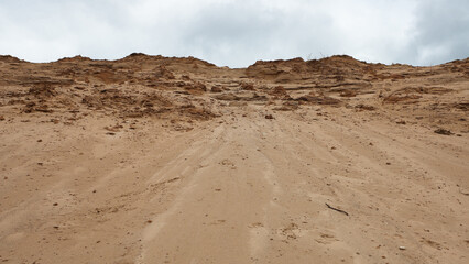 a sand quarry, in the photo a sand quarry and a gray sky in the background
