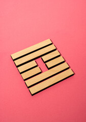 Gene Key 61 wood hexagram i ching on pink background