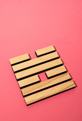 Gene Key 58 wood hexagram i ching on pink background